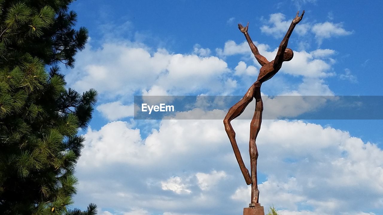 LOW ANGLE VIEW OF BARE TREE AGAINST SKY AND CLOUDS