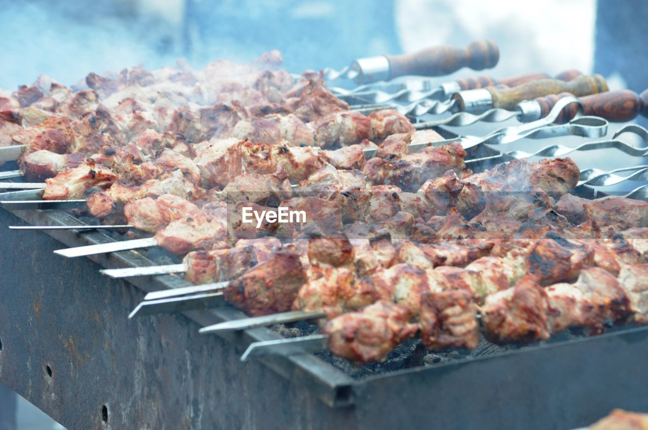 Close-up of meat on barbecue grill