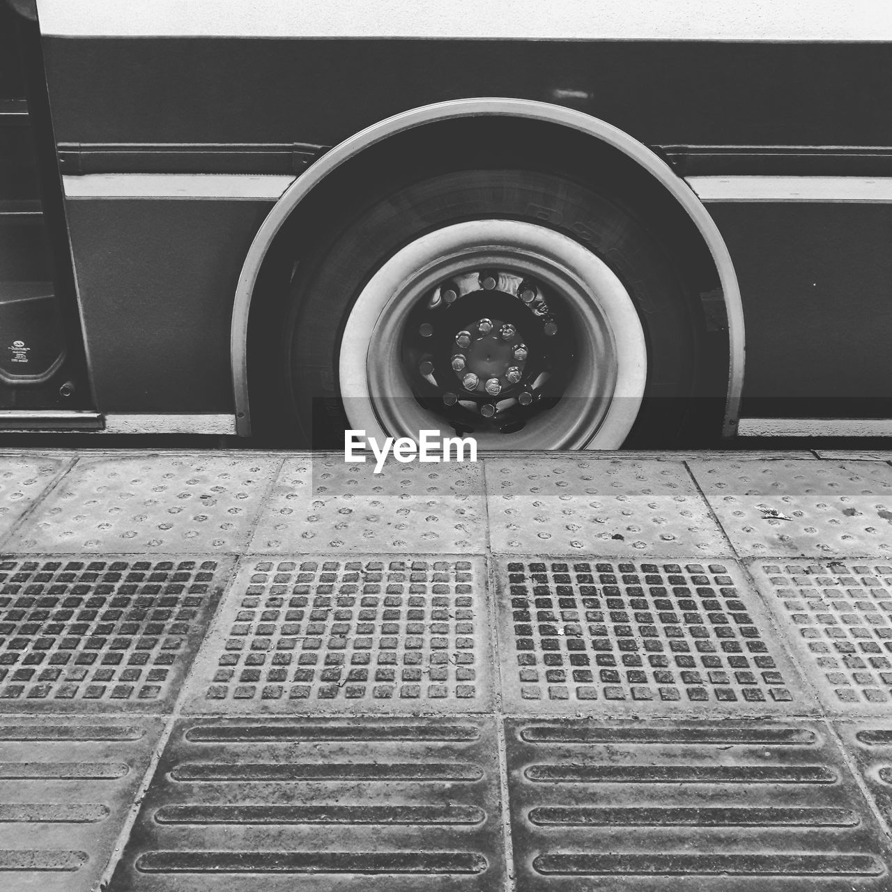 CLOSE-UP OF TIRE TRACK ON CAR