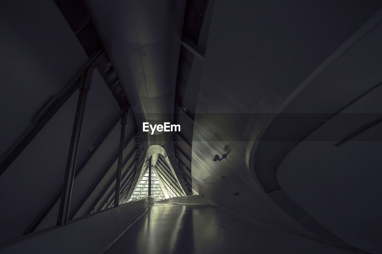 LOW ANGLE VIEW OF ILLUMINATED TUNNEL