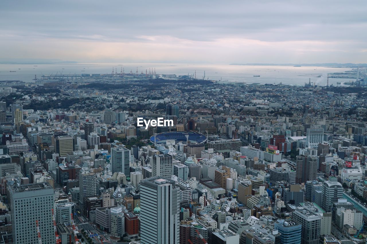 Aerial view of cityscape against sky