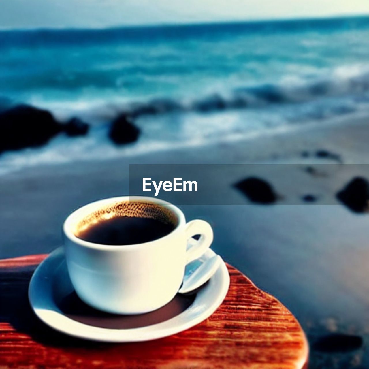 drink, coffee, mug, food and drink, cup, coffee cup, water, refreshment, sea, saucer, beach, land, horizon, morning, nature, crockery, hot drink, focus on foreground, horizon over water, table, blue, no people, relaxation, sky, outdoors, tea, day, heat, freshness, food