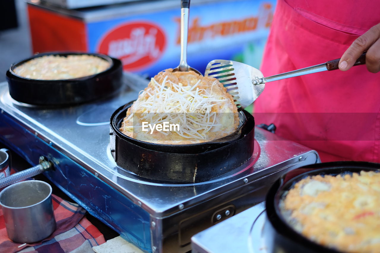 Close-up of man preparing food