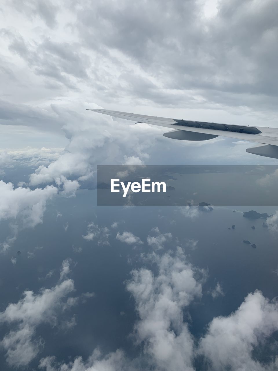 AERIAL VIEW OF CLOUDSCAPE OVER AIRPLANE