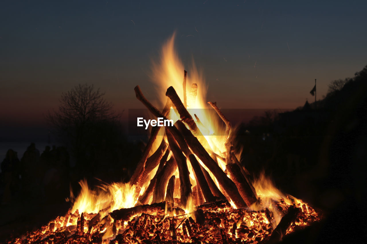 fire, burning, flame, heat, bonfire, nature, campfire, night, camping, log, glowing, motion, wood, fireplace, land, sky, tree, environment, orange color, no people, firewood, outdoors, long exposure, forest, beauty in nature, mountain