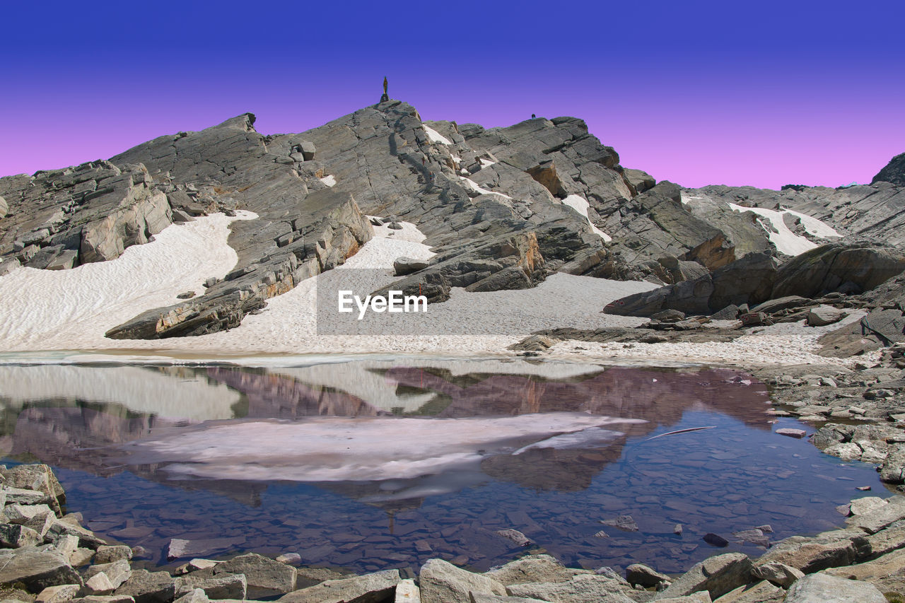 Panoramic view of emerald lake lago smeraldo in the pass of monte moro at dusk, piedmont, italy