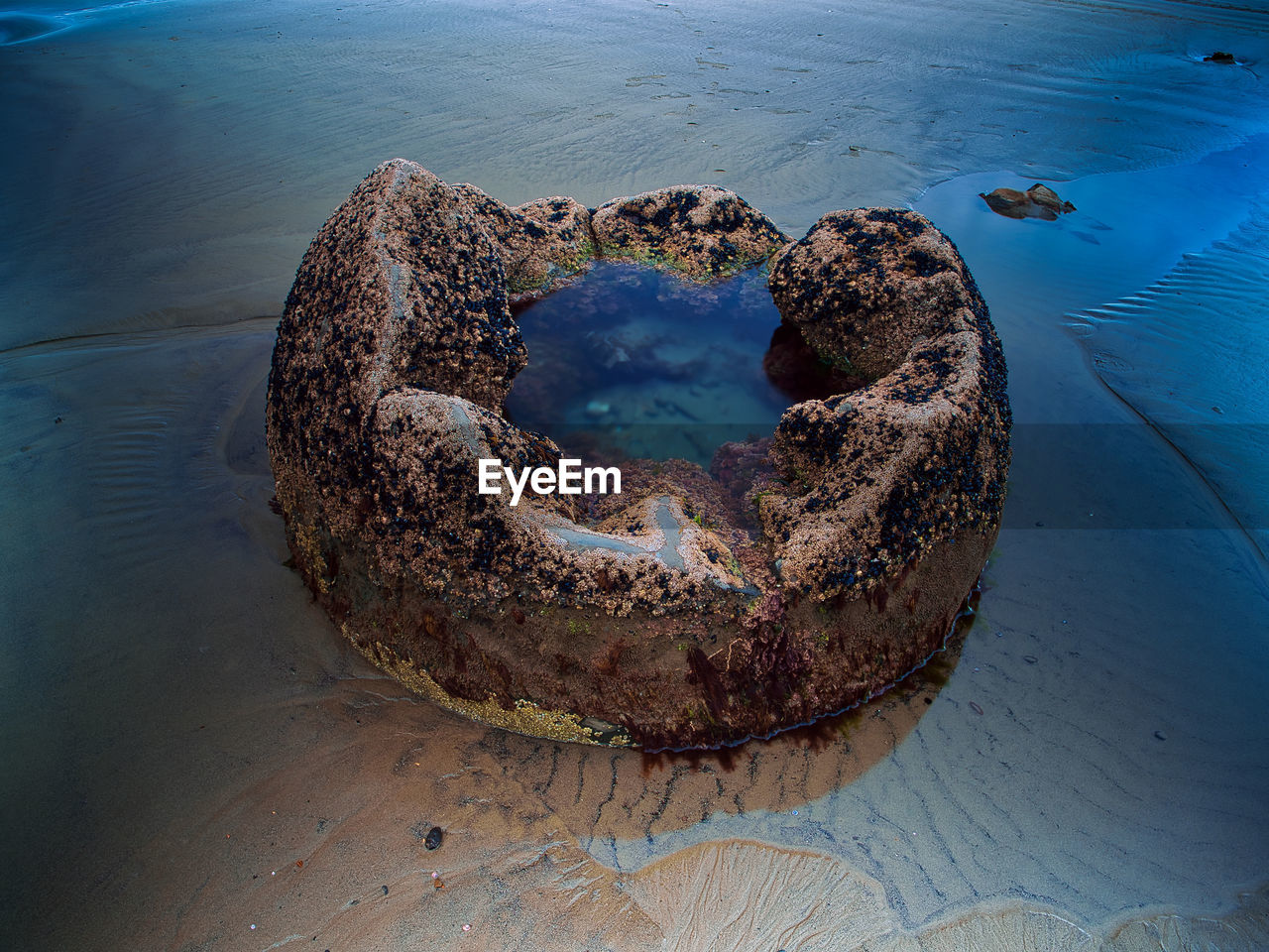 Broken boulder on beach