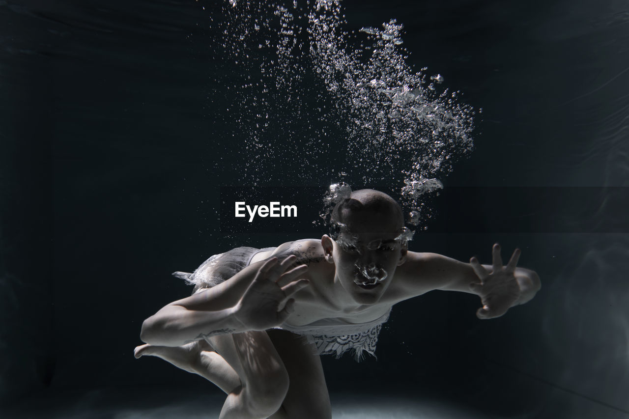 Portrait of woman swimming in sea