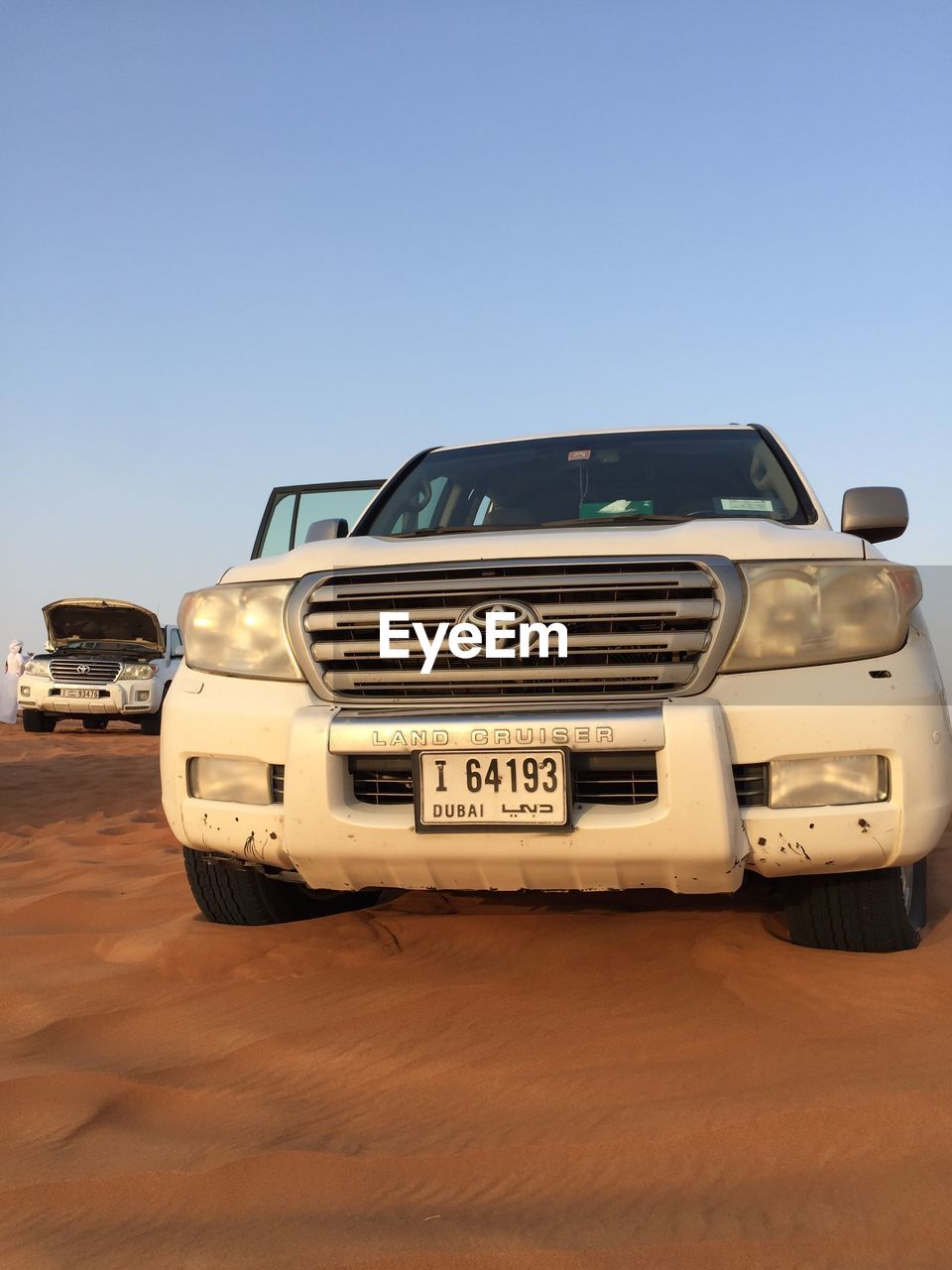 CAR AGAINST BLUE SKY