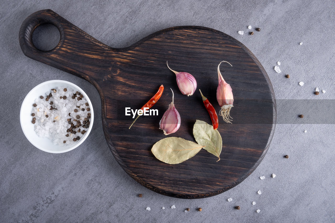 food and drink, food, wood, freshness, spice, directly above, leaf, ingredient, high angle view, no people, still life, healthy eating, gray, wellbeing, table, indoors, kitchen utensil, fruit, still life photography, plant part, seasoning