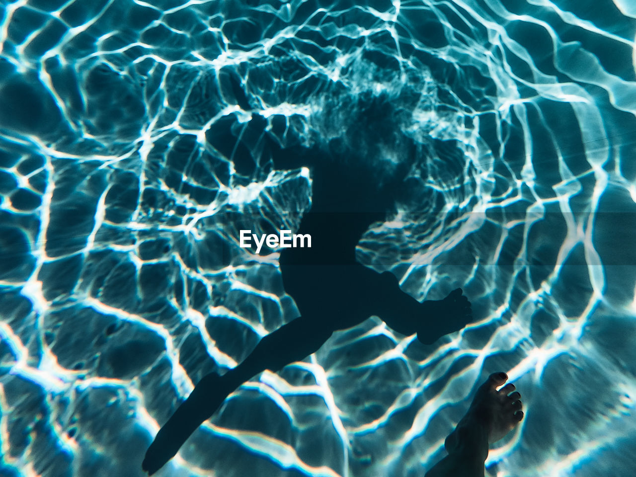 Full frame shot of swimming pool and human shadow