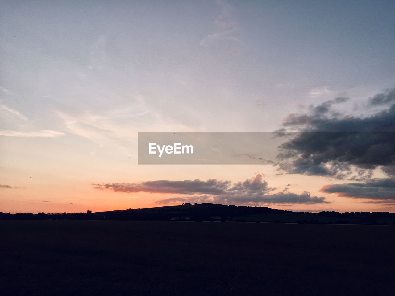 SCENIC VIEW OF DRAMATIC SKY OVER SILHOUETTE LANDSCAPE