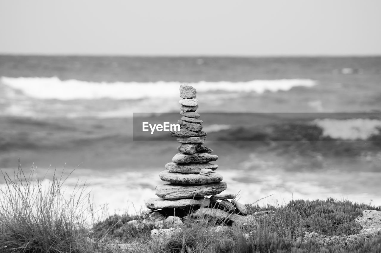 STACK OF STONES ON BEACH