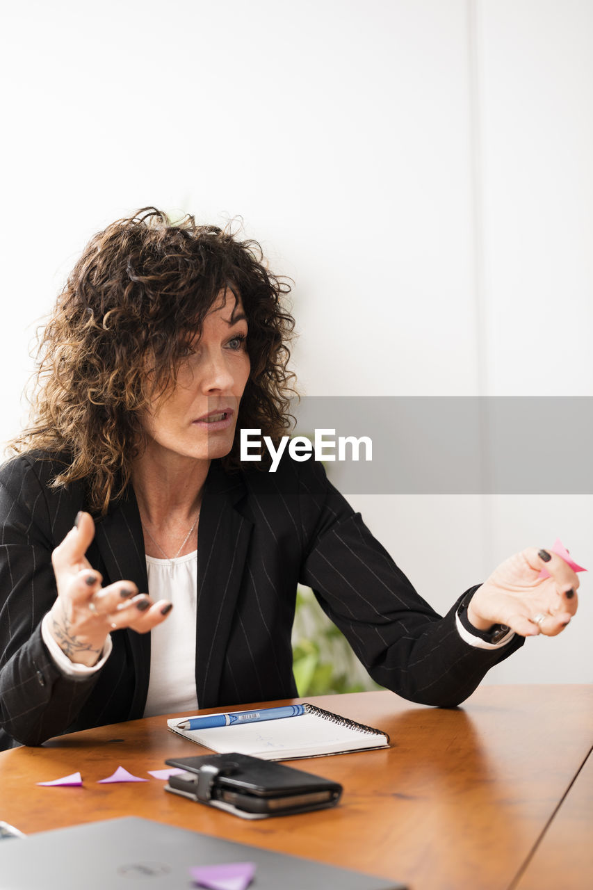 Businesswoman talking during business meeting