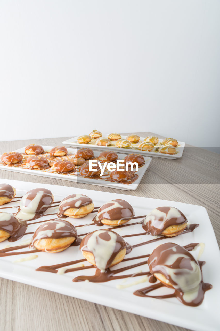 Close-up of desserts in trays on table