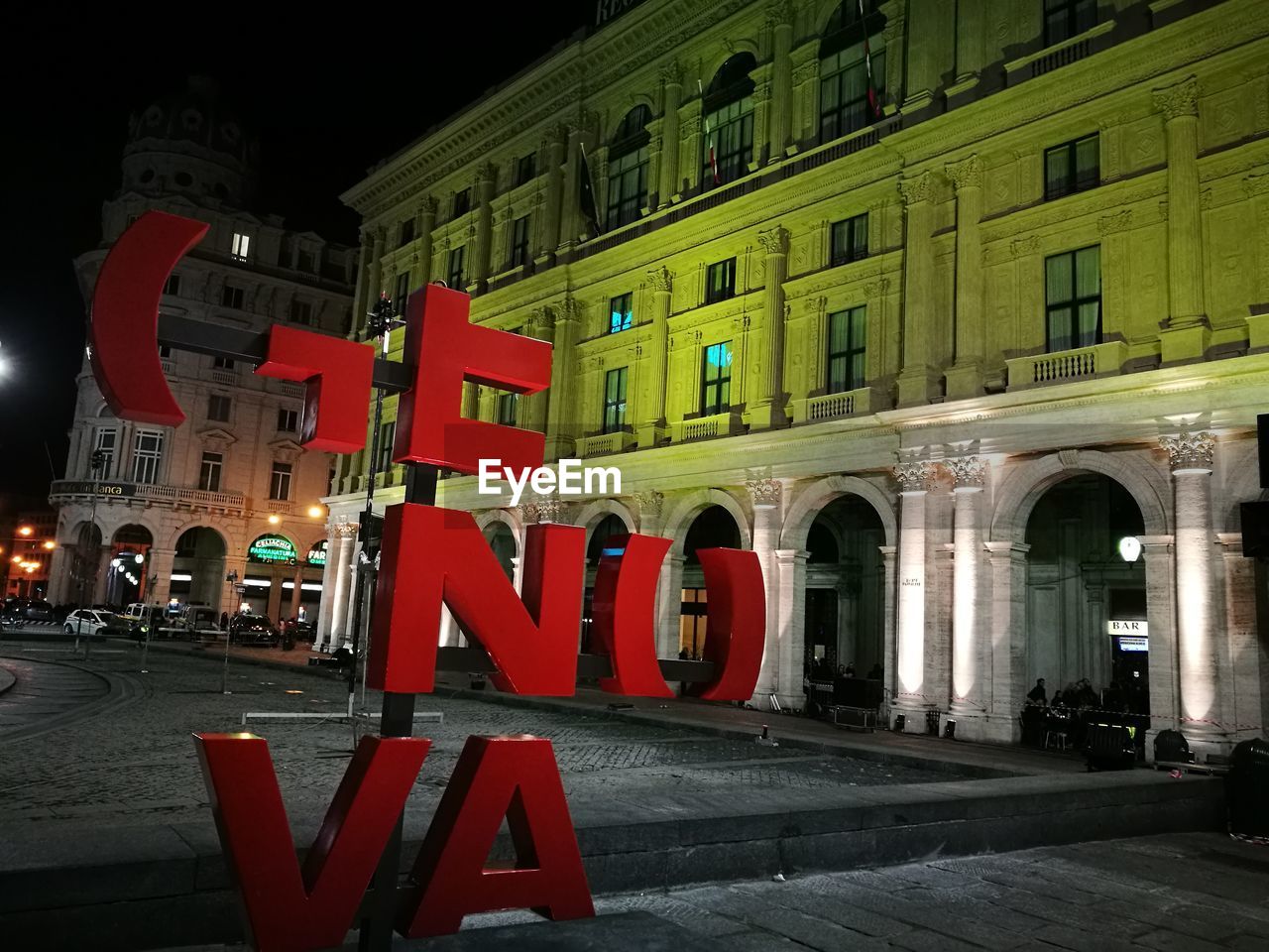 VIEW OF ROAD SIGN AT NIGHT