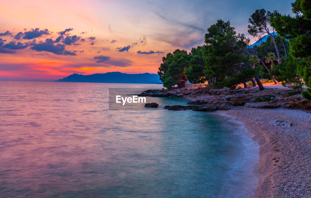 Scenic view of sea against sky during sunset