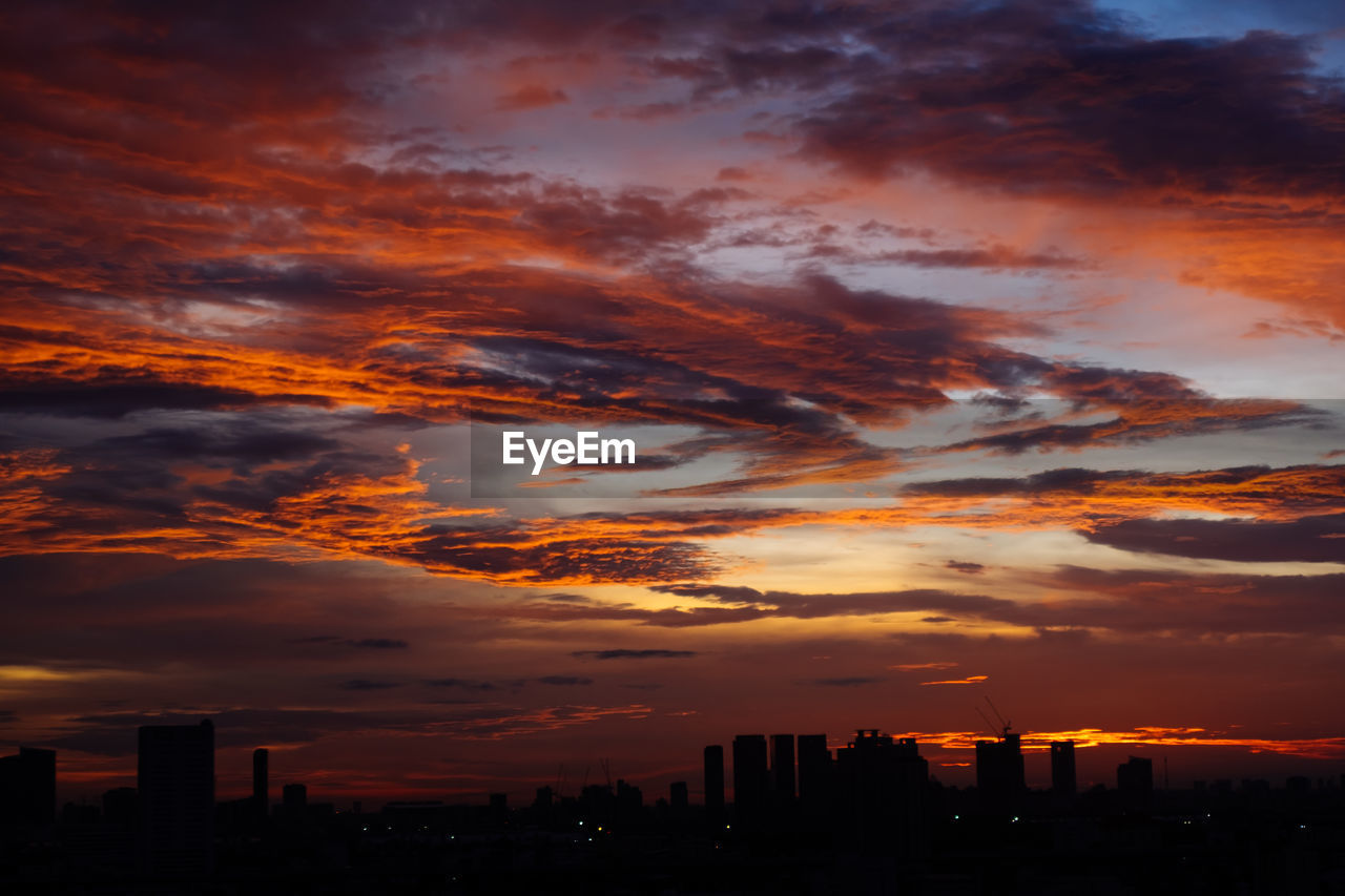 Silhouette landscape against scenic sky