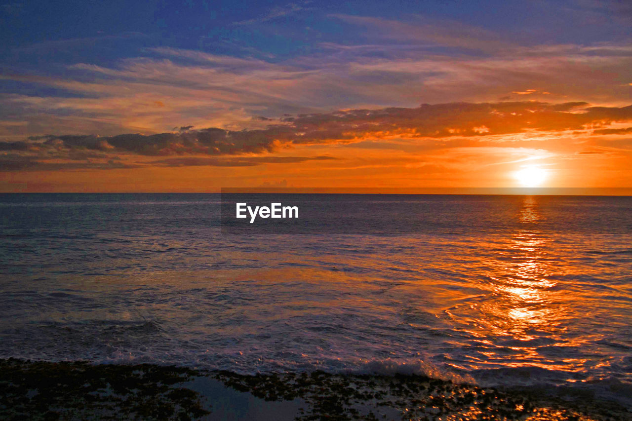 View of calm sea at sunset