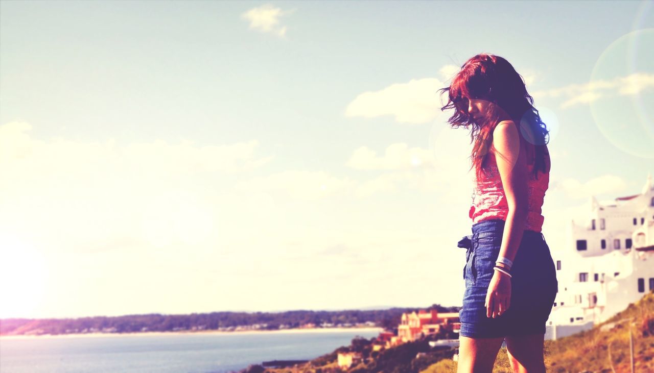 Young woman contemplating at seaside