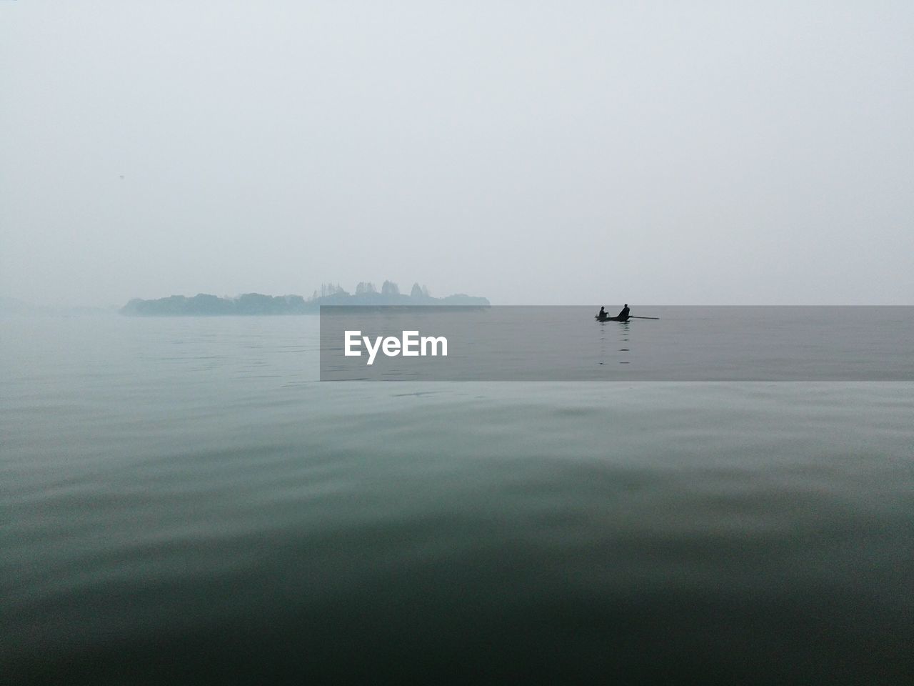 Scenic view of sea against sky during foggy weather