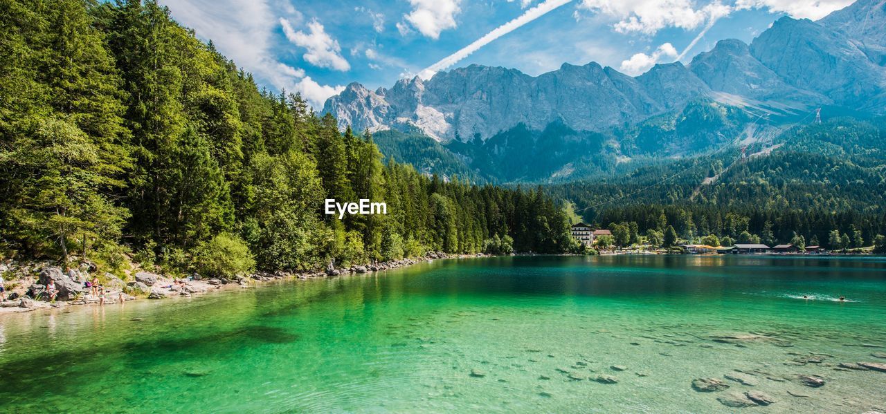 Scenic view of lake against cloudy sky