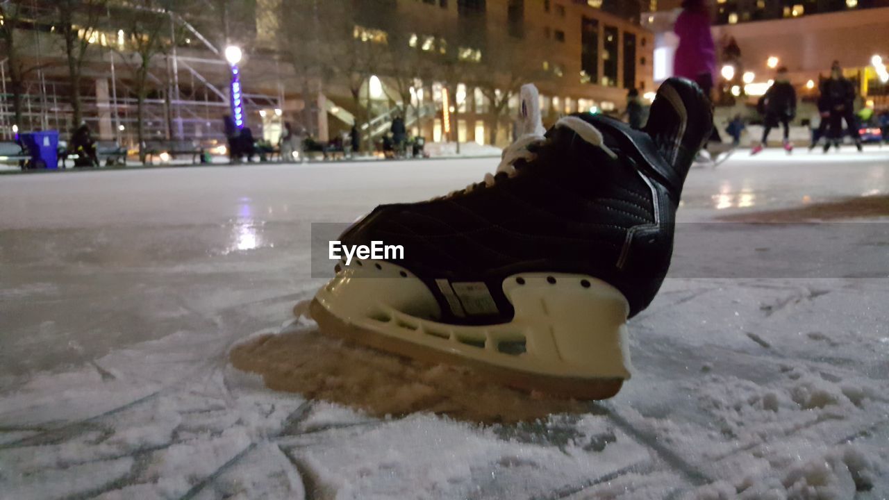 CLOSE-UP OF ILLUMINATED LIGHTING EQUIPMENT IN SNOW