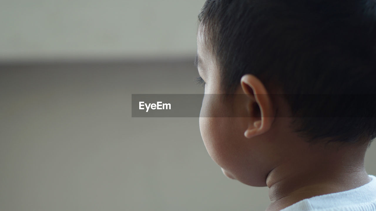 Close-up of boy looking away