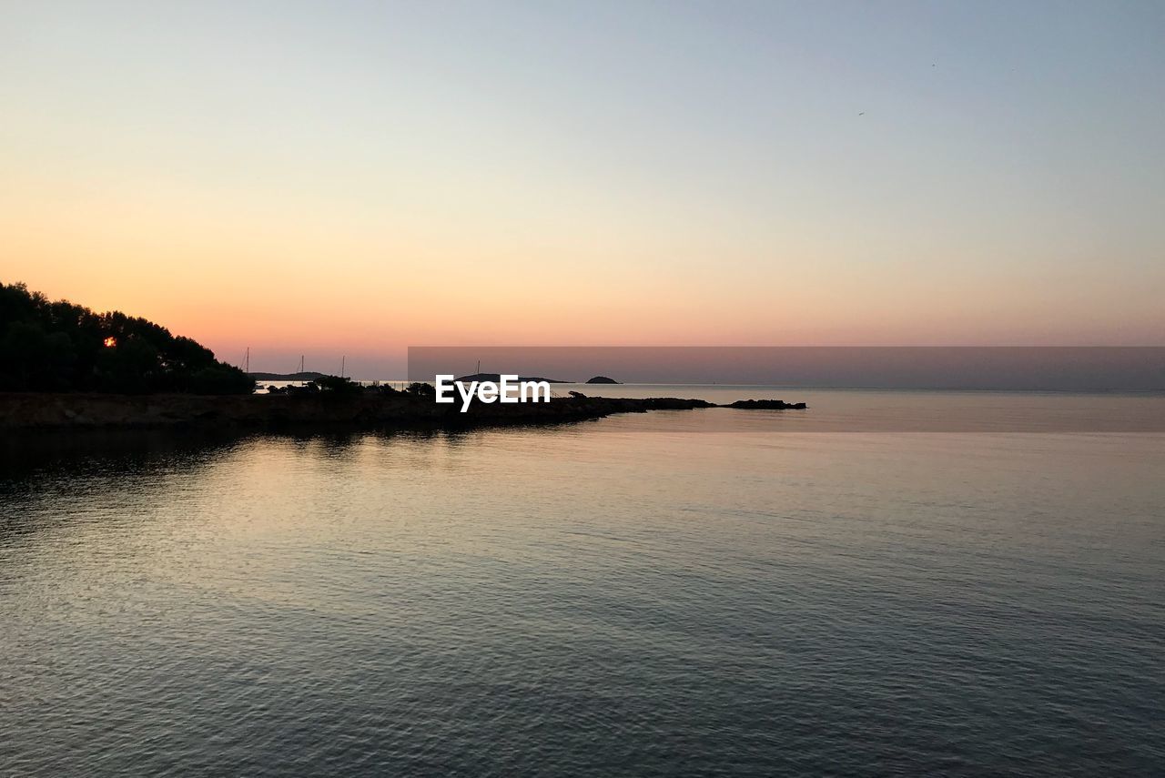 SCENIC VIEW OF SEA DURING SUNSET