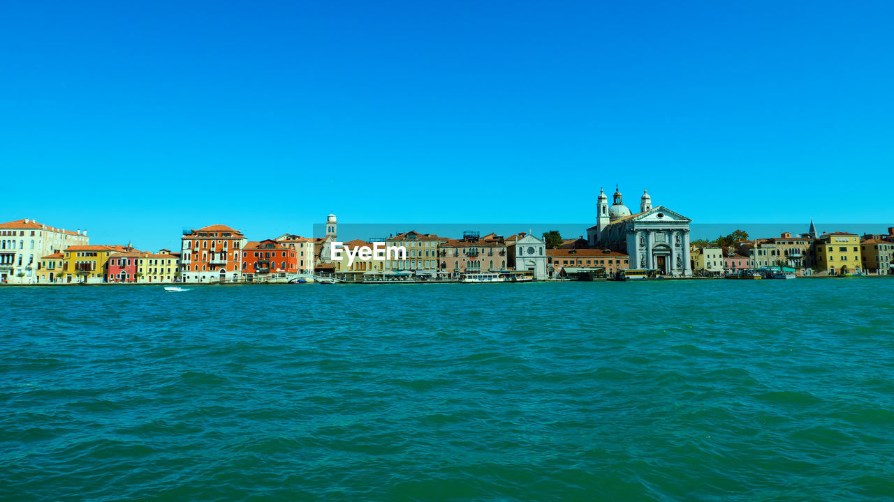 VIEW OF BUILDINGS AT WATERFRONT