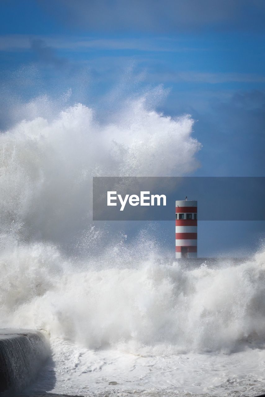 LIGHTHOUSE AGAINST SEA