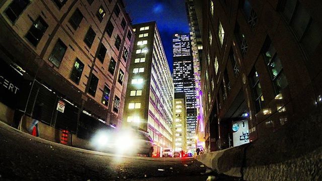 ILLUMINATED CITY STREET AT NIGHT