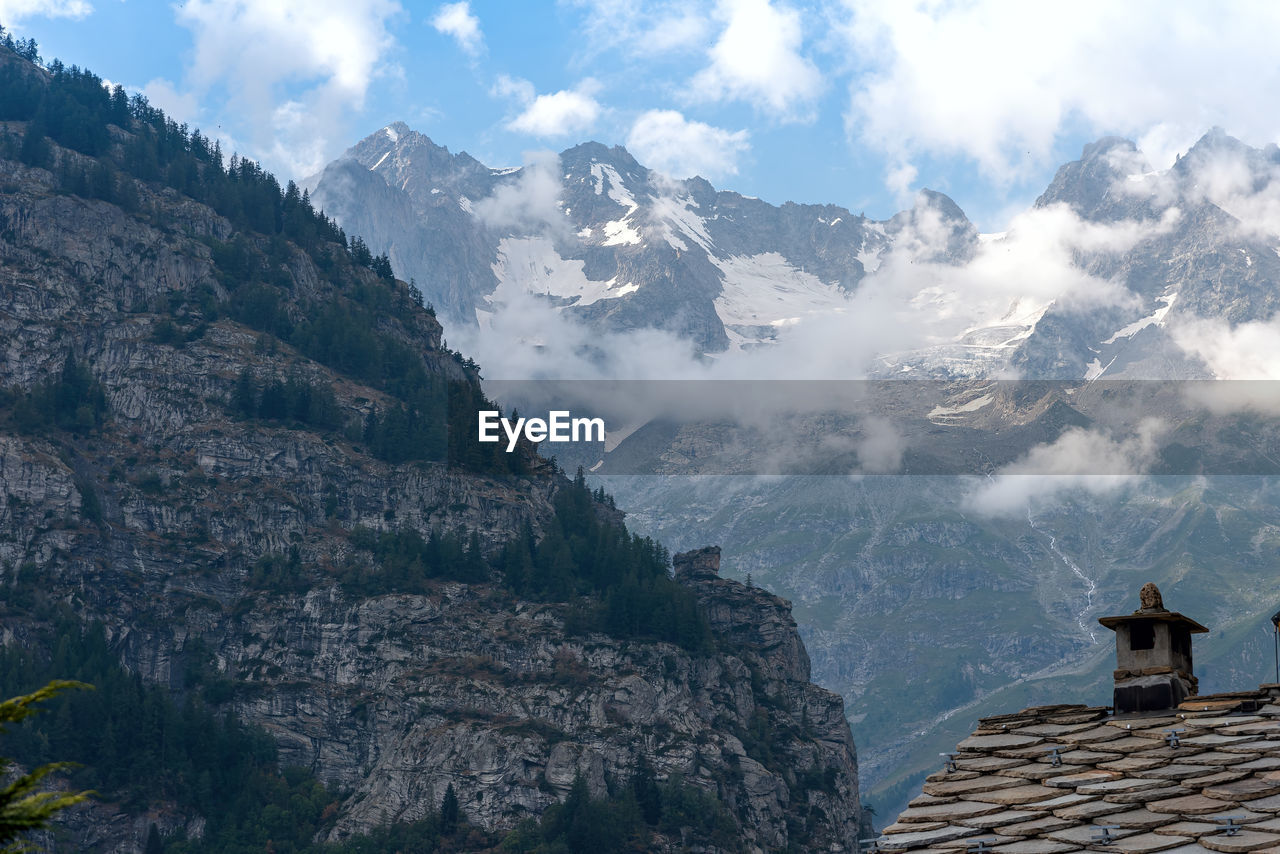 Low angle view of mountain range against sky