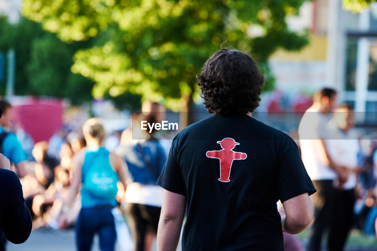 Rear view of man walking in city