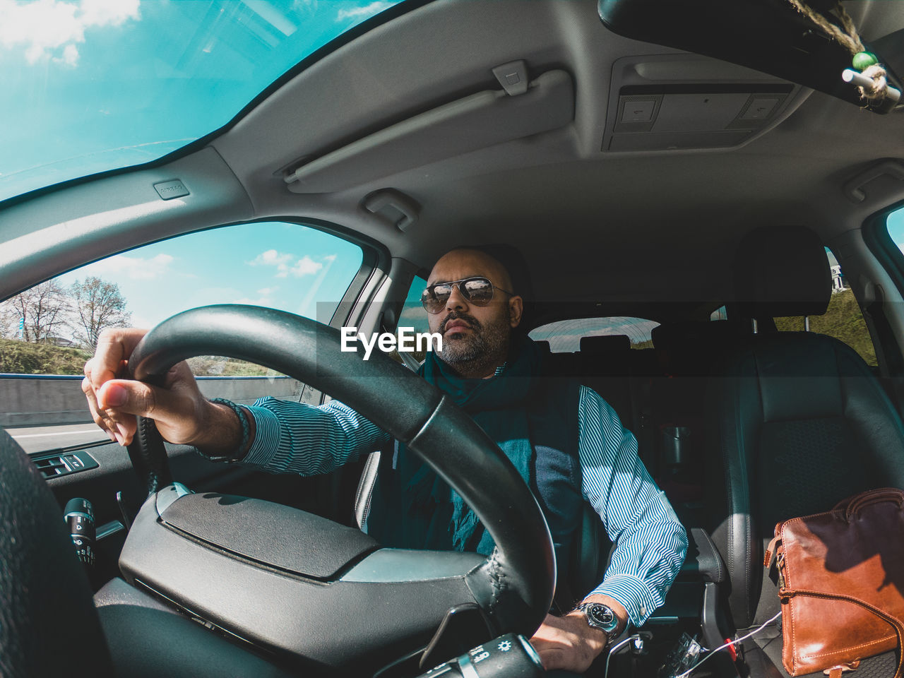 REFLECTION OF MAN IN CAR