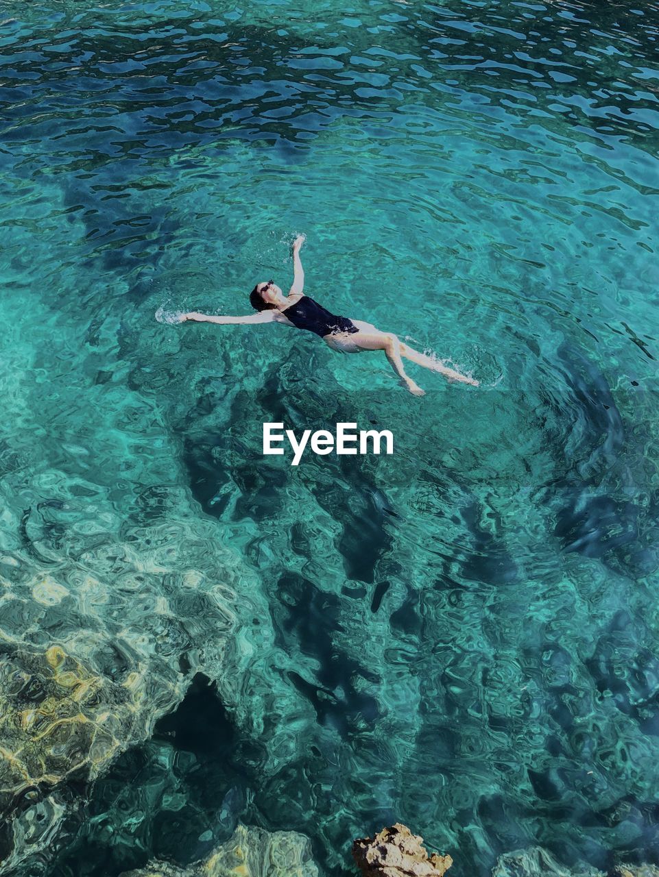 Woman swimming in sea