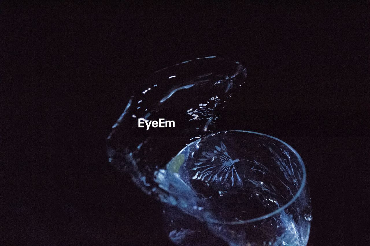 Close-up of glass against black background