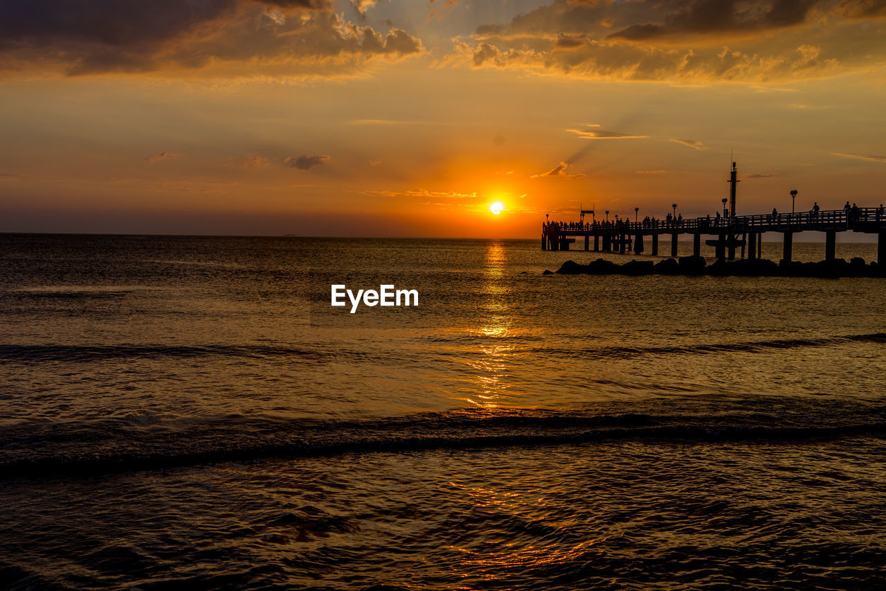 Scenic view of sea against sky at sunset