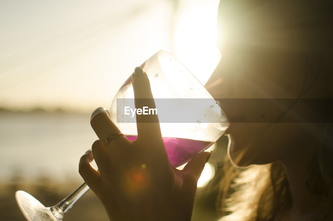 Close-up of woman drinking wine