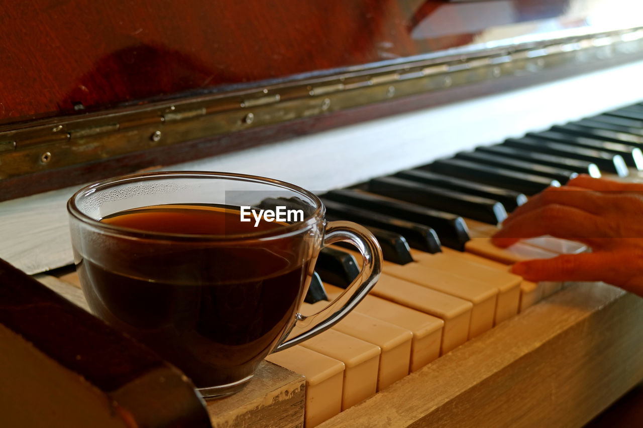 CLOSE-UP OF COFFEE CUP AND TEA