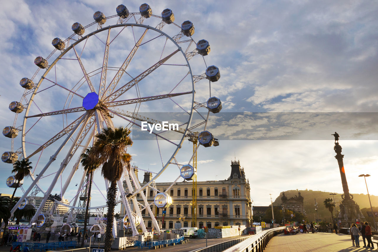 LOW ANGLE VIEW OF FERRIS WHEEL AGAINST SKY