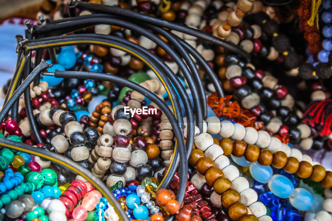 Close-up of multi colored jewelry for sale in market