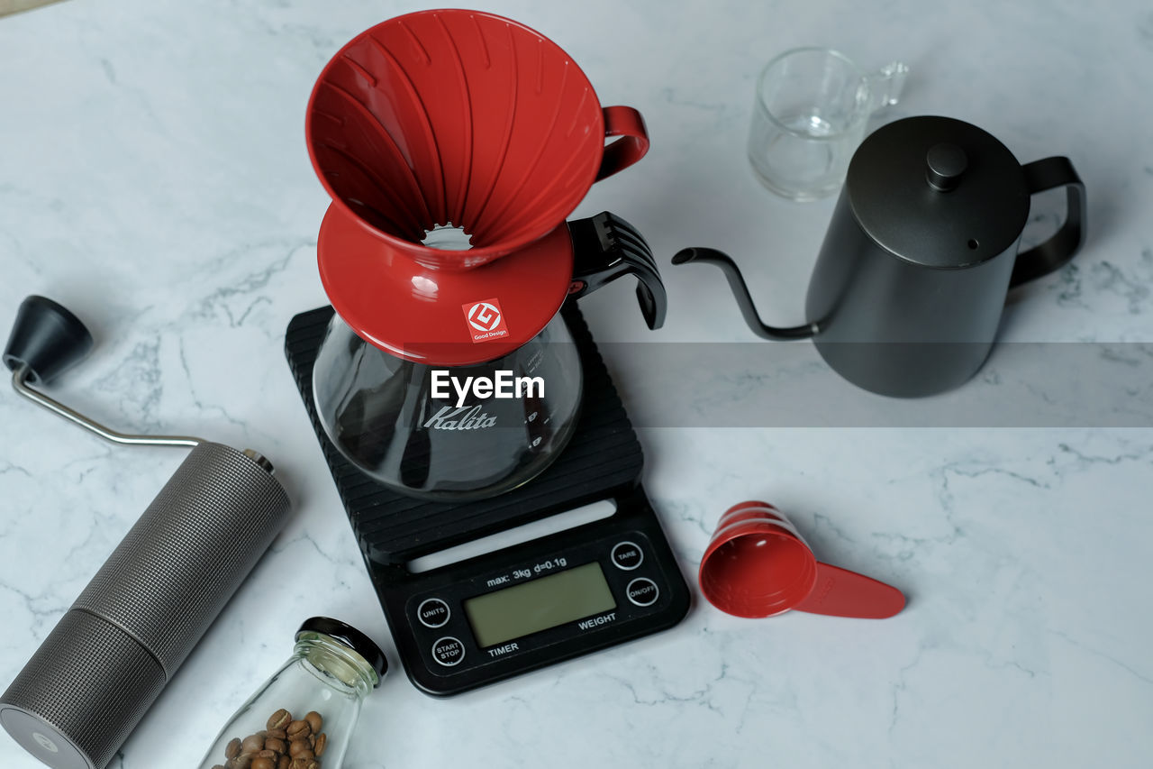 HIGH ANGLE VIEW OF WINE AND COFFEE ON TABLE