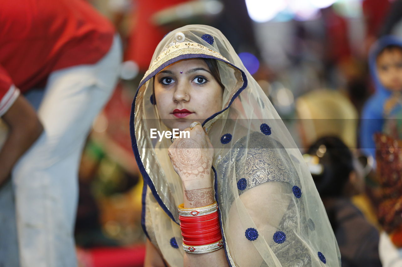 Close-up portrait of woman in sari
