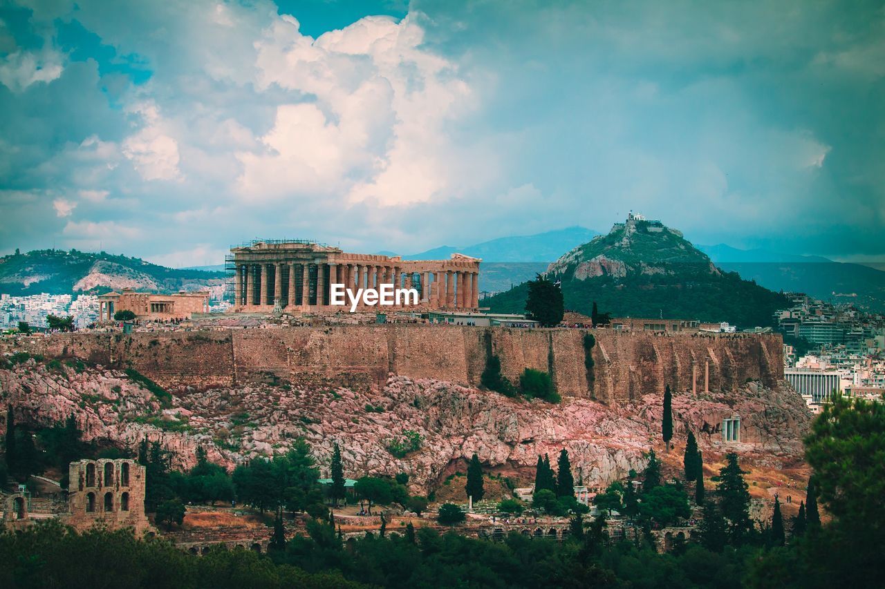 View of acropolis against cloudy sky