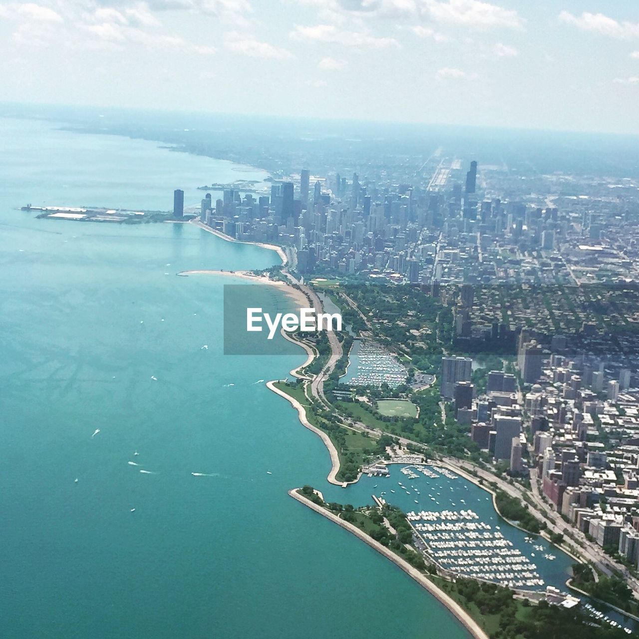 Aerial view of cityscape by sea