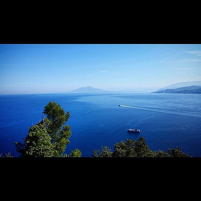 VIEW OF SEA AGAINST BLUE SKY