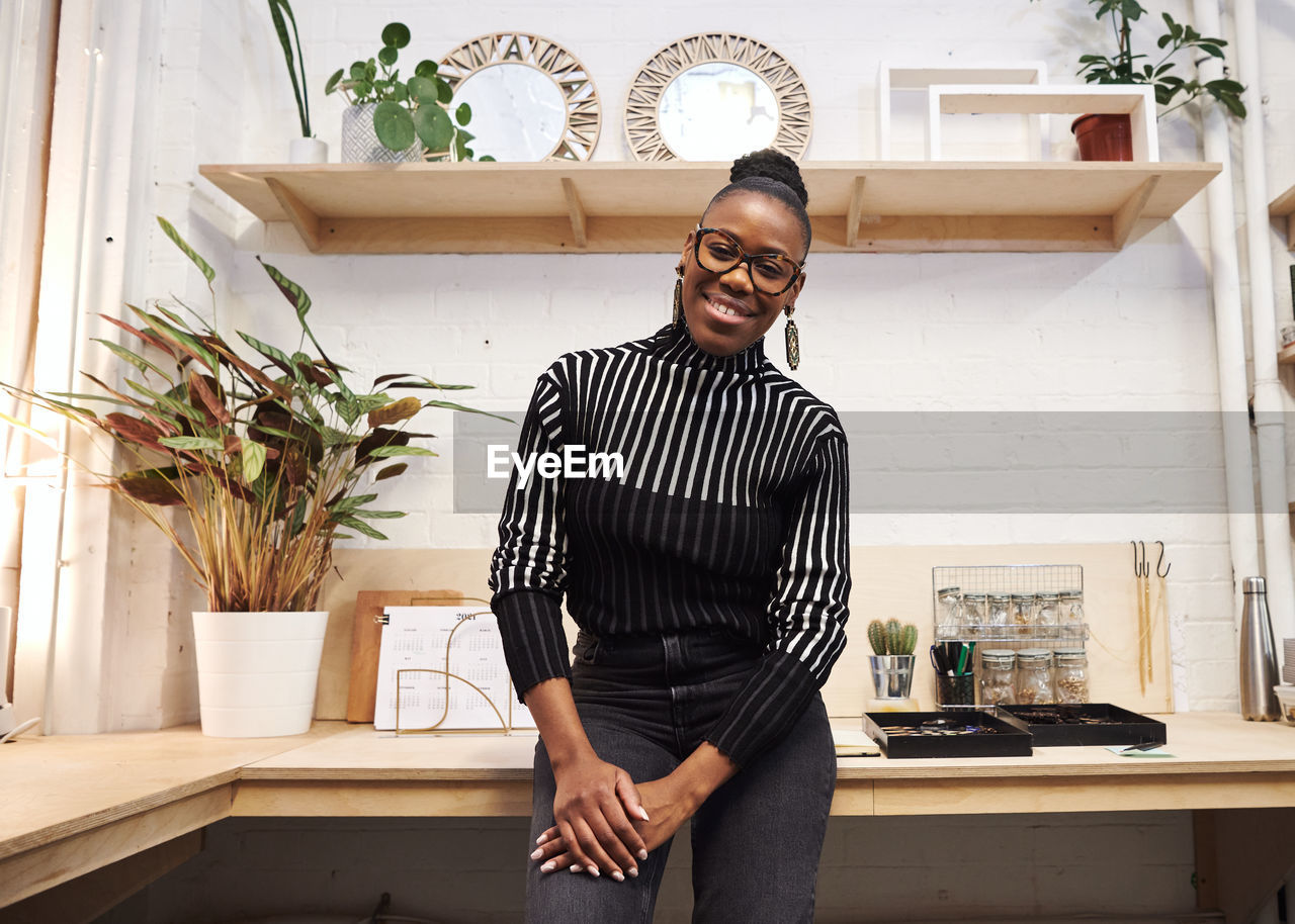 Portrait of businesswoman standing at office