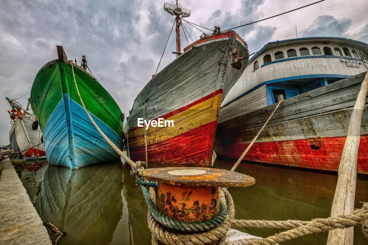 FISHING BOAT MOORED IN SEA