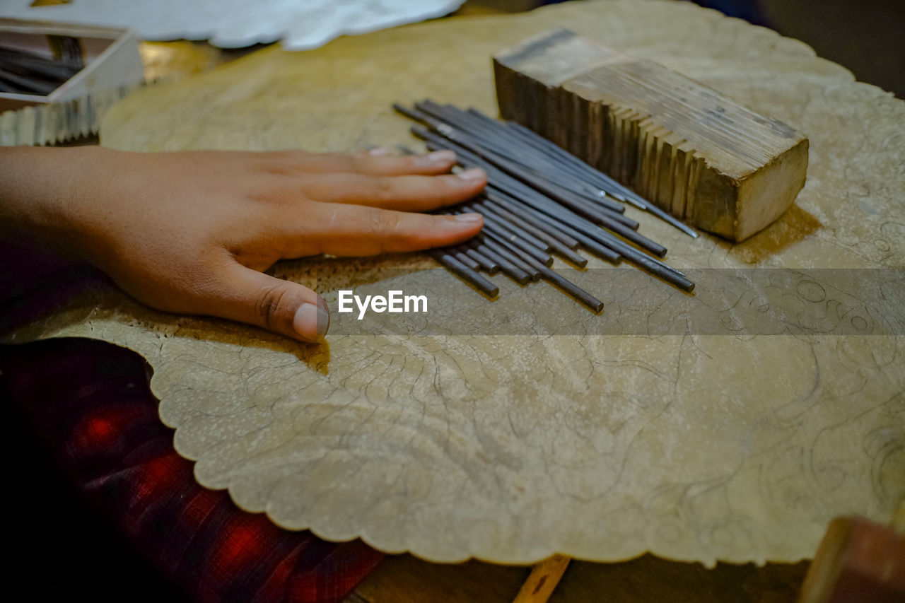 HIGH ANGLE VIEW OF PERSON WORKING